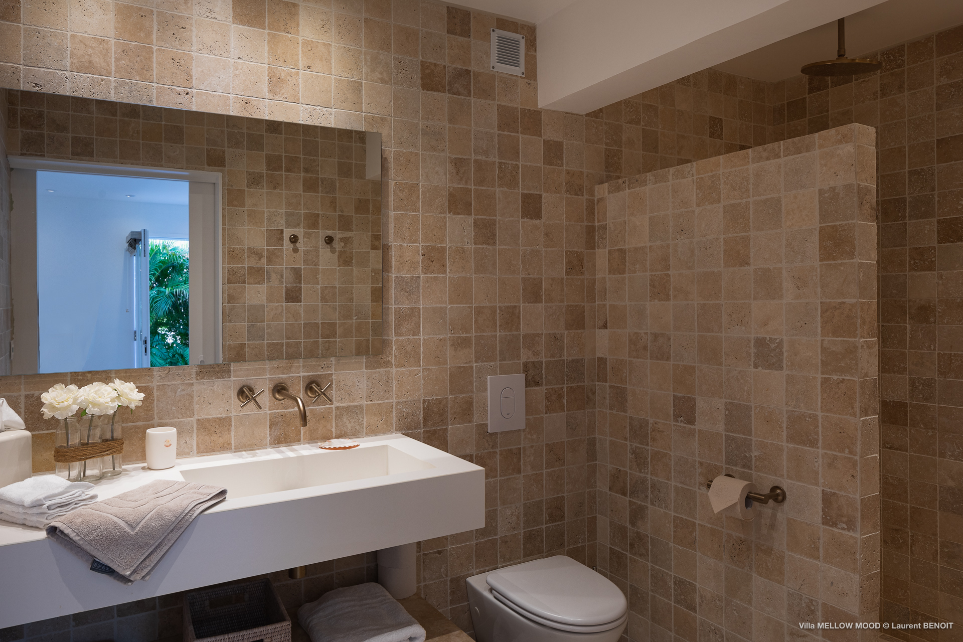 Stone bathroom with natural light at Mellowmood