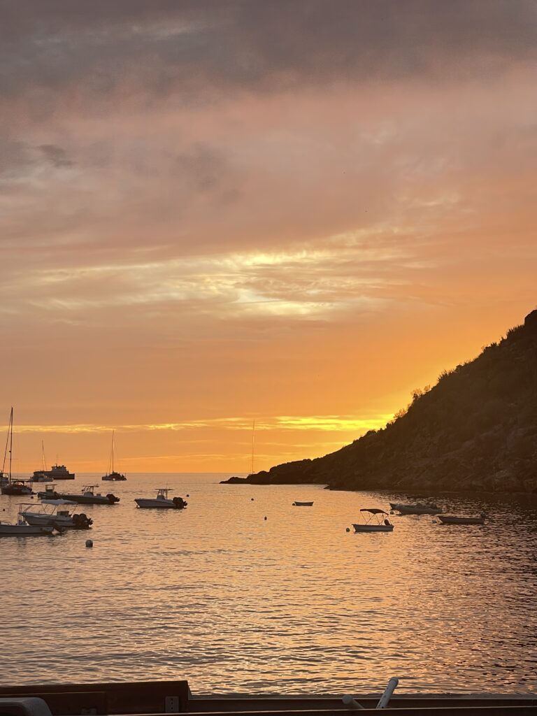 Orange sky over calm sea in St Barth evening